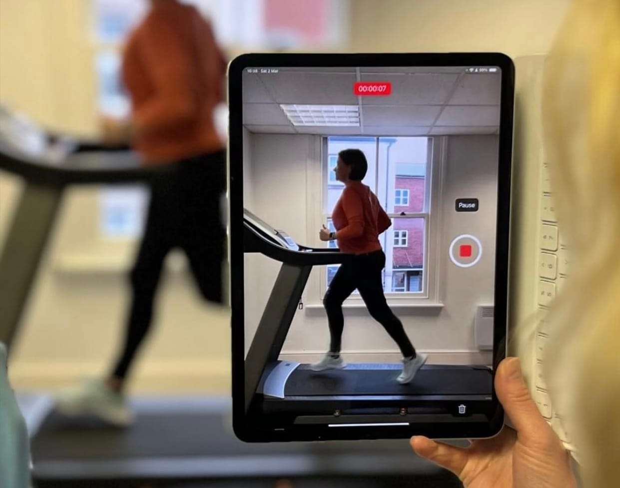 Video gait analysis on a tablet of a runner on the clinic treadmill